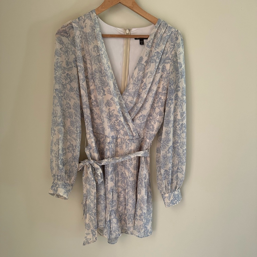 Like new Express, (never worn) size small baby blue pleated romper